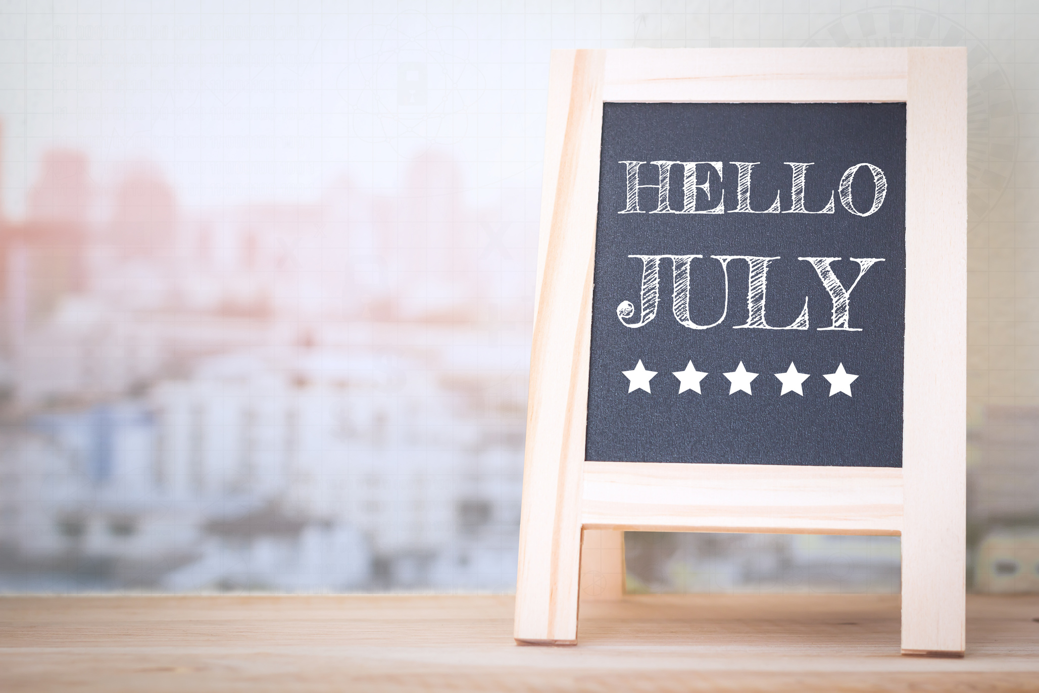 Concept HELLO JULY message on wood boards
